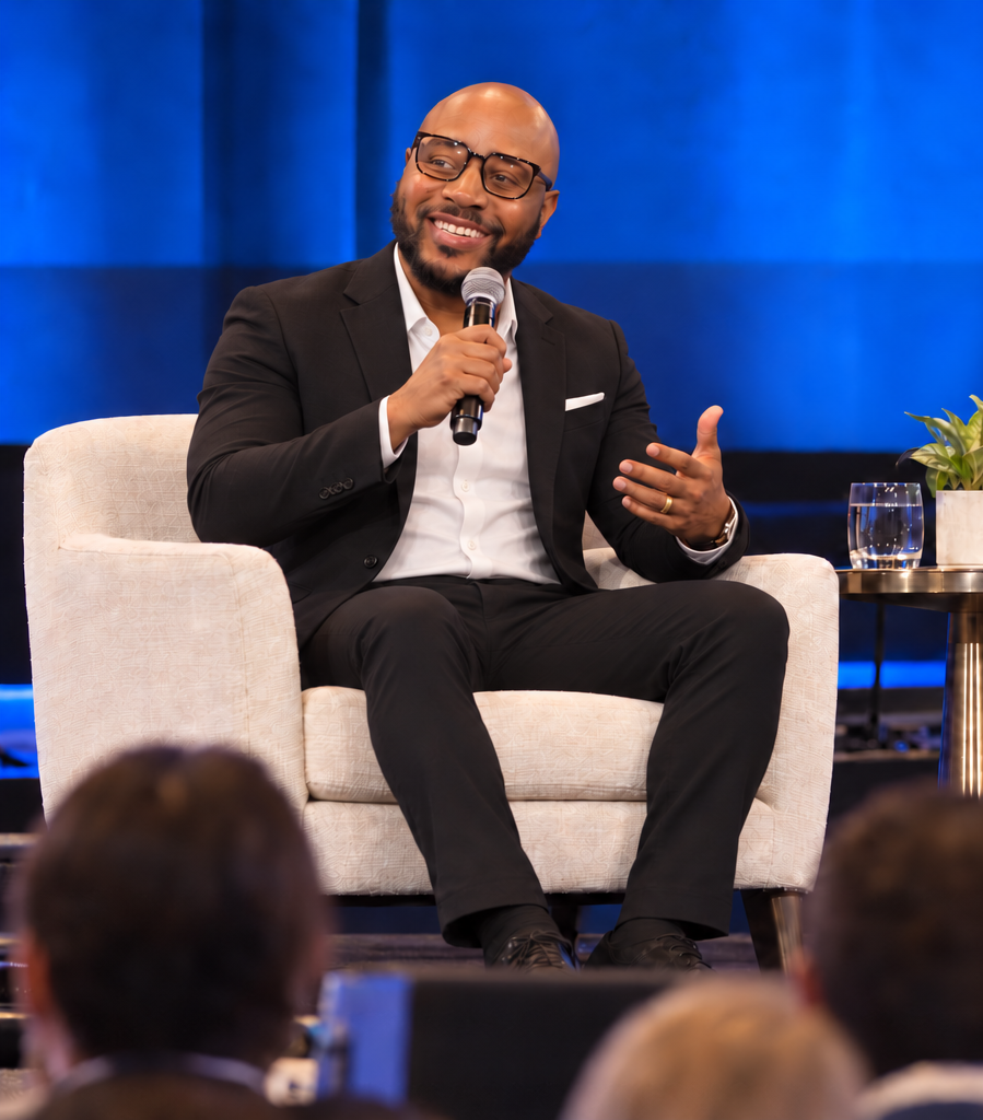 Jaison Lane speaking onstage